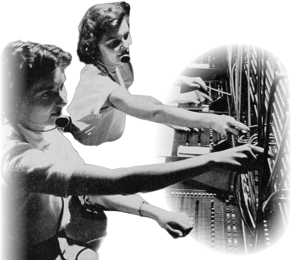 A row of switchboard operators, every pair of hands reaching for a different jack.